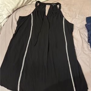 Sleeveless black dress with white details